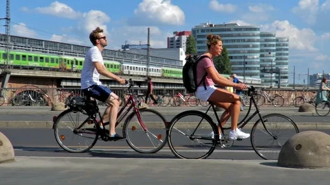 Berlin - Cyclists ride over a bridge near Jannowitzbrucke Train Station. Видео 99400192
