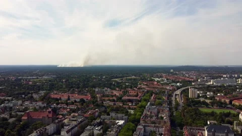 Berlin district covered by large cloud of white smoke.
Smooth aerial view Stock Footage 203869906