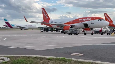 Berlin: Easyjet Airbus A320 jet is parked on apron at Berlin Airport, 4K Stock Footage 206061036