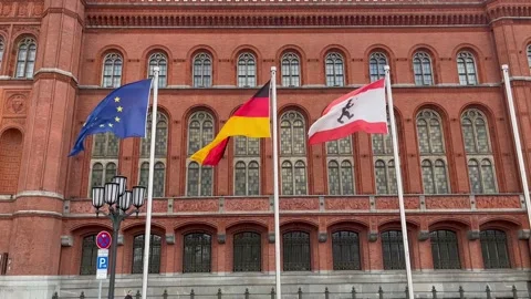 Berlin: Flags waving in front of Rotes Rathaus city hall in Mitte district, 4K Stock Footage 169854175