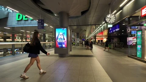 Berlin, Germany - 10/24/2024: Attendees queue at a busy, well-lit station Stock Footage 289632064