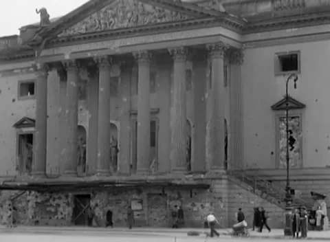 BERLIN, GERMANY - 1945: Bomb Damage - Shell Scars Across a Grand Portico Stockbeeldmateriaal 343942243