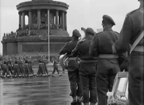 BERLIN, GERMANY - 1945: Rainy parade - Troops march in rain at Victory Column Видео 344495764