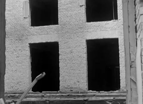 BERLIN, GERMANY - 1945: Square ruins - Blasted wall frames damaged facade Stock Footage 344494719