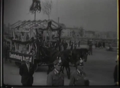 BERLIN, GERMANY - 1946: Building float — A house frame rides through town Stock Footage 347227244