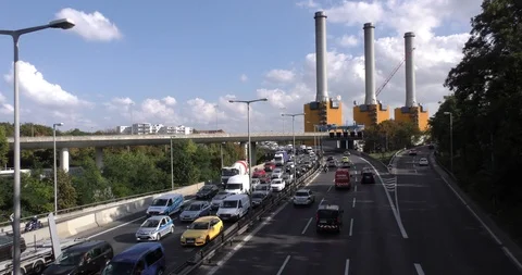 Berlin, Germany - 21/09/2016: traffic jam on highway, factory in the background Stock Footage