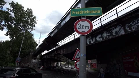 Berlin, Germany - August 24, 2025:  Friedrichshain sign under railway bridge Video stock 315613481