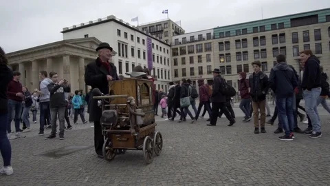 Berlin Germany Brandenburg Gate Square Man Plays Street Organ Handheld Stock Footage 75835351