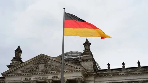 BERLIN, GERMANY. German flag fluttering in the wind in front of Reichstagin Stock Footage 127154392