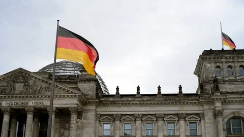 BERLIN, GERMANY. German flag fluttering in the wind in front of Reichstagin Stock-Footage 127154393