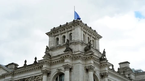 BERLIN, GERMANY. German flags fluttering in the wind in back side of Reichstagin Stock-Footage 127154405