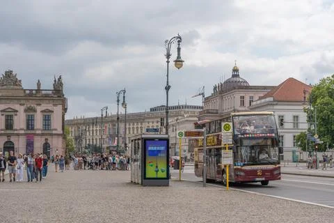 Berlin, Germany July 18, 2026. Sightseeing Bus at Bebelplatz with Berlin Palace 스톡 사진