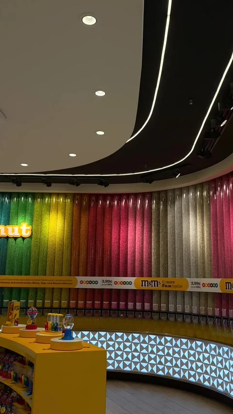 Berlin, Germany - July 2, 2026: M&amp;M's store with a wide range of sweets Stock Footage 339040439
