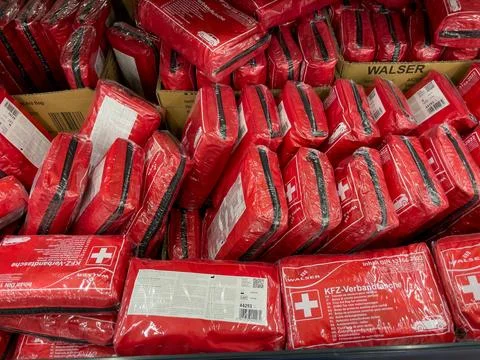 Berlin, Germany, May 10, 2024 A stack of red Walzer first aid kits 스톡 사진