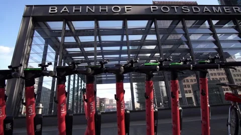 Berlin, Germany - May 16, 2025: Line of Volt e-scooters with blinking lights Stock Footage 309799577