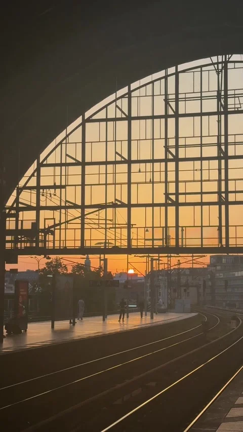 Berlin, Germany - May 23, 2026 - train station platform silhouetted against Stock Footage 338126376