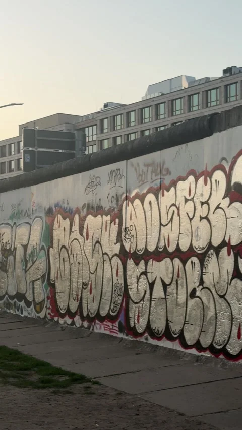 Berlin, Germany - May 23, 2026 - berlin wall, urban concrete barrier adorned Stock Footage 339090094