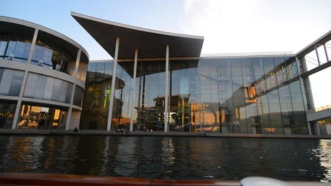 BERLIN GERMANY MAY 26 2017 Glass building from boat view in sunset. Stock-Footage 127154015