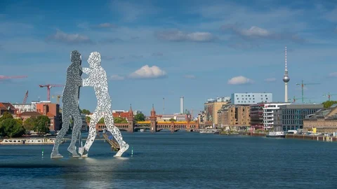 BERLIN, GERMANY - MAY,2019: Molecule Man statue on Spree river in Berlin city Stock Footage 124876453