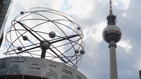 BERLIN GERMANY. Monument of Clock with world time on Alexanderplatz Stock Footage