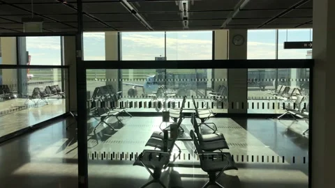 Berlin, Germany - November, 2020: Empty airport lobby with view on airplane a Stock Footage 144476978