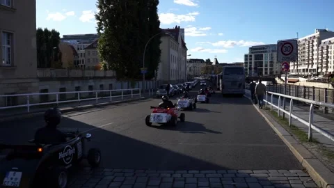 Berlin, Germany - October 18, 2025: Group of hot rod mini cars driving on street Stock Footage 319442017