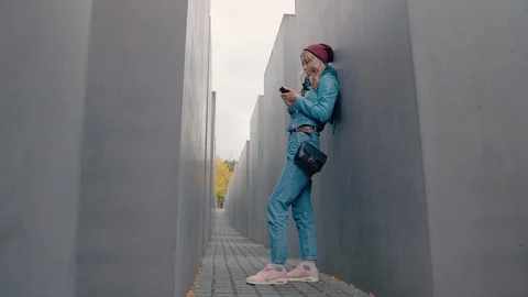 BERLIN, GERMANY - October 2018: Slow Motion Caucasian girl tourist stands Stock Footage 106823924
