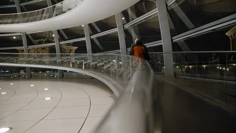 BERLIN, GERMANY - October 2018: Two male customers climb the ramp at the mall Stock Footage 108922230