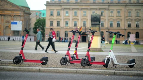 BERLIN, GERMANY - SEPTEMBER, 2022: View of multiple parked Voi and Lime electric Stock Footage 218511581