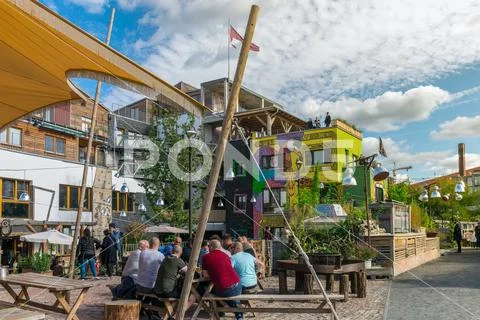 BERLIN, GERMANY - September 26, 2018: Colorful overview of a group of men sit Stock Photos