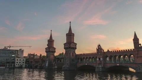 Berlin Germany sunset skyline sunset time lapse at Oberbaum Bridge Spree River Stock Footage 245221228