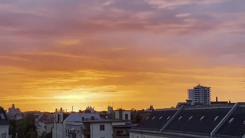 Berlin: Golden hour during sunset over Charlottenburg with clouds in the sky, 4K Stock Footage 284464264