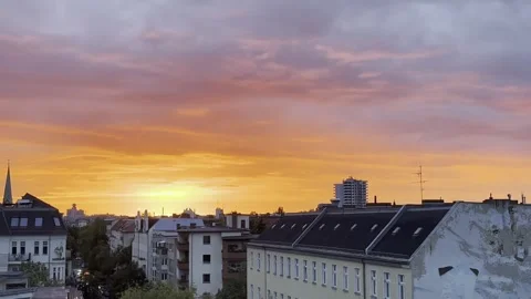 Berlin: Golden hour during sunset over Charlottenburg with clouds in the sky, 4K Stock Footage 284464277