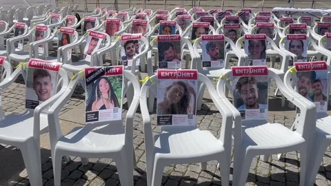 Berlin: Installation with empty chairs and portraits of Israeli hostages, 4K Stock Footage 275551459