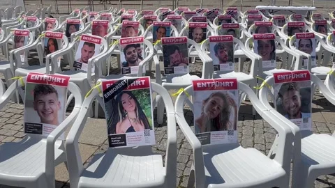 Berlin: Installation with empty chairs and portraits of Israeli hostages, 4K Stock Footage 275551473