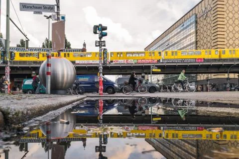 BERLIN - OCTOBER 19, 2016: Reflection of people on bicycles and Berlin Yellow Stock Photos
