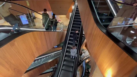 Berlin: People ride on escalators at the KaDeWe department store, 4K Stock Footage 258667730
