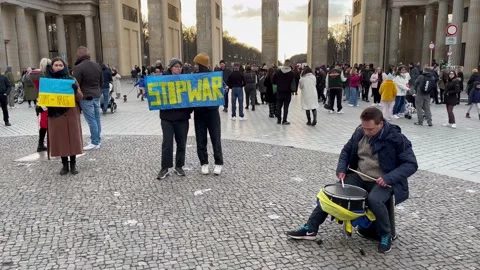Berlin: Protest at the Brandenburg Gate against war in the Ukraine, 4K Stock Footage 171375744