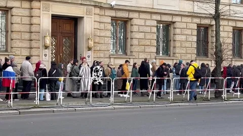Berlin: Russian citizens standing in queues in front of the Russian Embassy, 4K Stock Footage 268808150