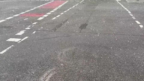 Berlin: Sleet and snowflakes fall on the street on a windy winter's day, 4K Stock Footage 237374173