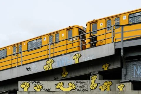 Berlin subway train (U-Bahn) on bridge with graffiti Stock Photos