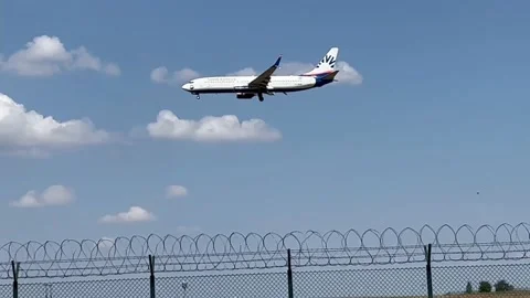 Berlin: SunExpress Boeing 737-800 jet approaches Berlin Airport for landing, 4K Stock Footage 202314878