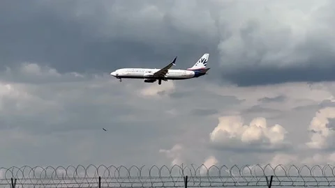 Berlin: SunExpress Boeing 737-800 jet approaches Berlin Airport for landing, 4K Stock Footage 202314906