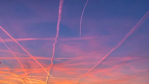 Berlin: Sunset with condensation trails in a beautiful colorful sky, 4K Stock Footage 303834072