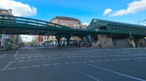 Berlin train over a bridge with people and traffic underneath in time lapse Stock Footage 33732578