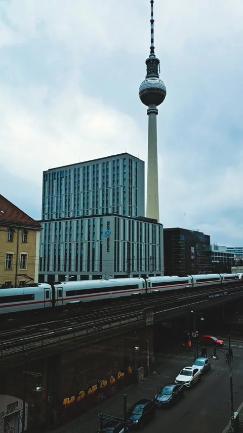 Berlin, train on overpass. Berlin TV tower Video stock 235094773