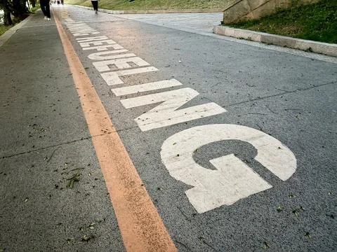 "Berlin Wall Graffiti on a Path" Stock Photos