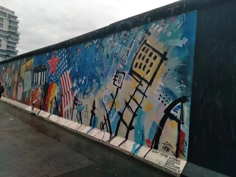Berlin Wall mural featuring the U.S. flag and a red star Stock Photos