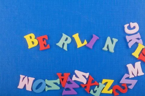 BERLIN word on blue background composed from colorful abc alphabet block wo.. Stock Photos