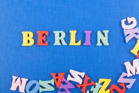BERLIN word on blue background composed from colorful abc alphabet block wo.. Stock Photos